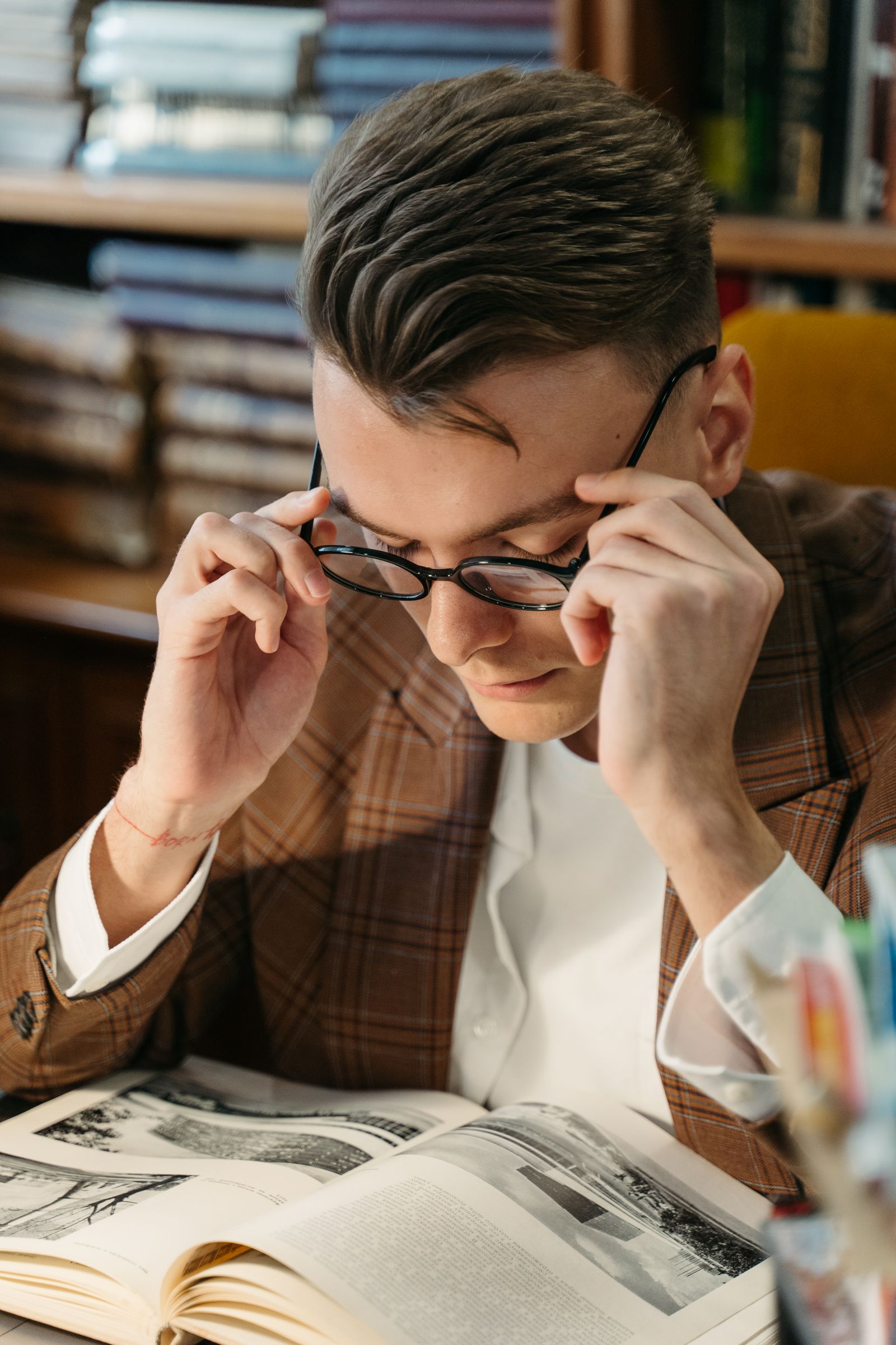 Close-up of a man reading a book
